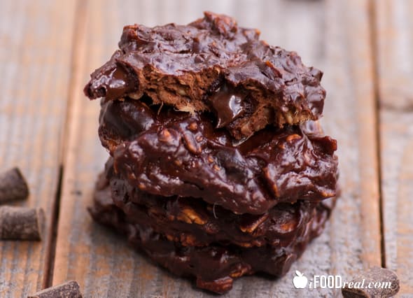 Chocolate protein cookies with chocolate chips stacked.