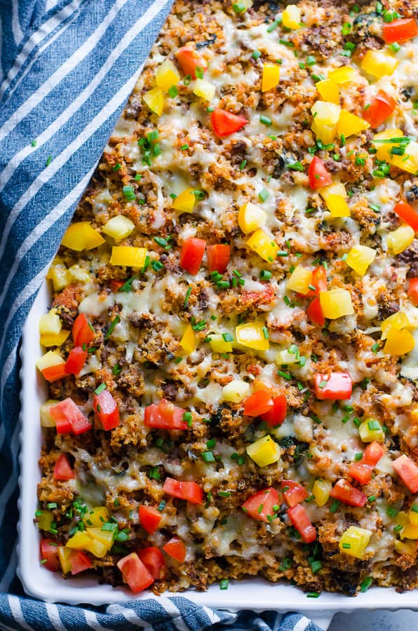 ground turkey quinoa casserole in a casserole dish with a blue napkin