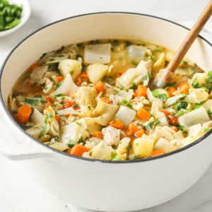 A bowl of soup with Chicken and Noodle and vegetables.