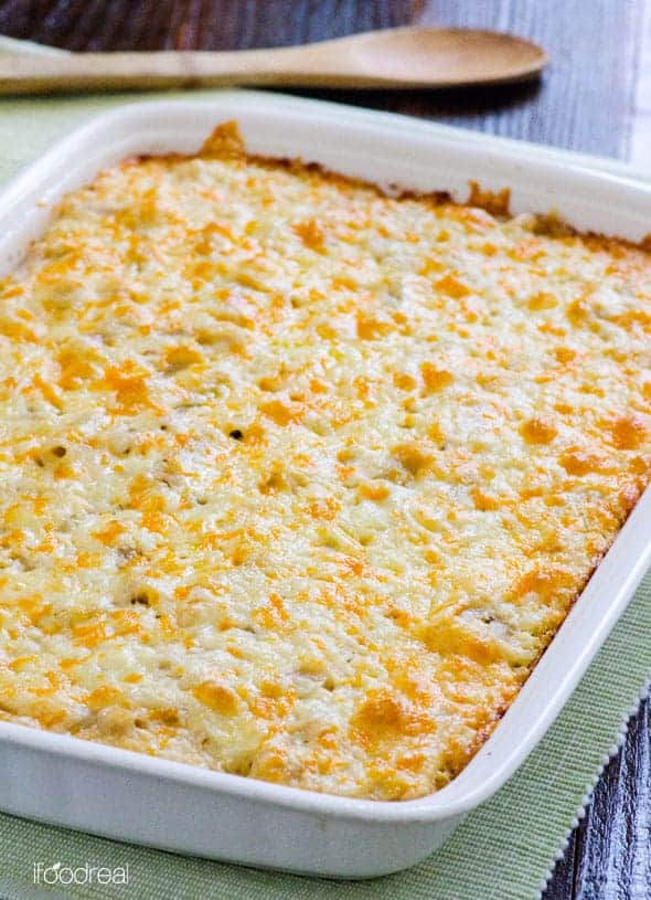 Baked cauliflower mac and cheese in white baking dish.