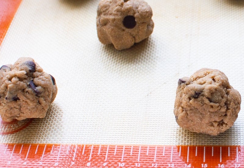 Cookie dough balls on silpat lined baking sheet