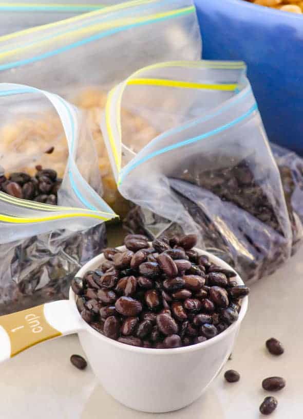 placing 1 cup of black beans in freezer bags