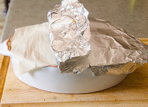 Zucchini Potato Bake in a casserole dish covered with tin foil. 