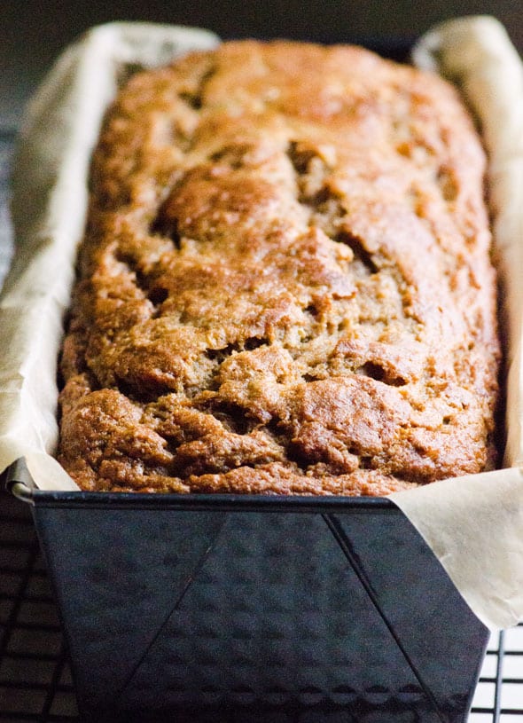 Healthy banana bread in black loaf tin.