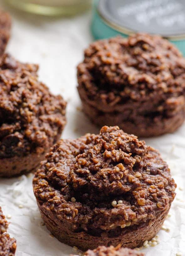 Chocolate quinoa muffins on parchment paper.