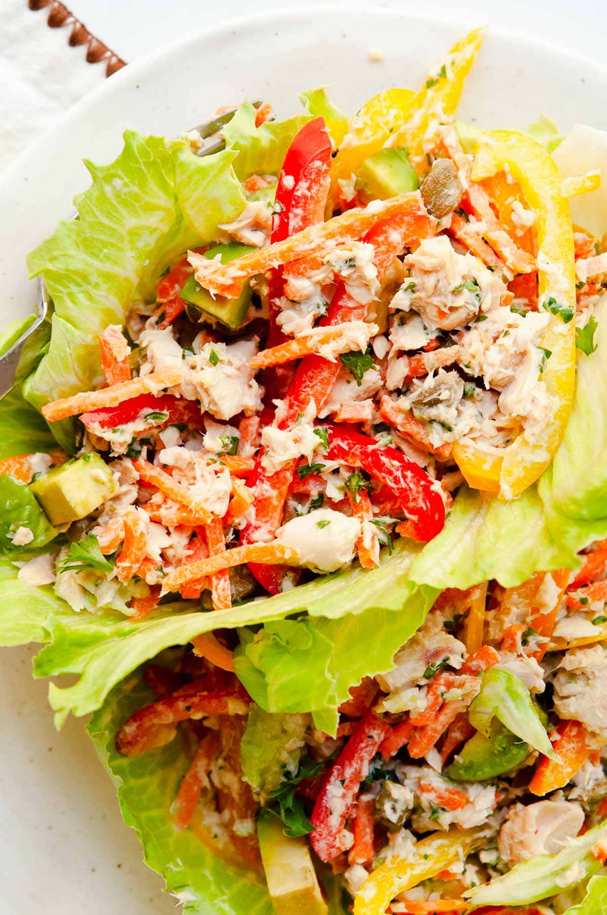 Canned salmon salad in lettuce leaves cups.