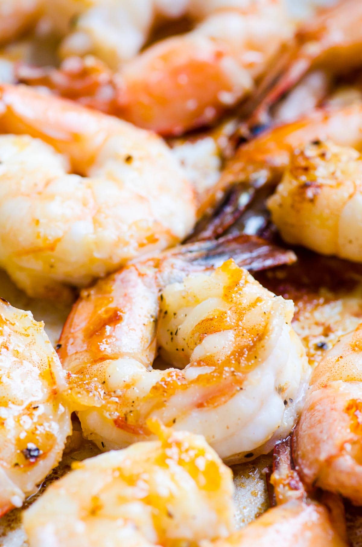 Sauteed shrimp in skillet.