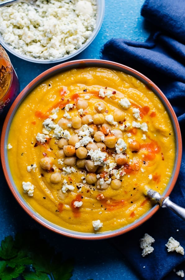 Cauliflower soup topped with chickpeas, blue cheese and hot sauce.