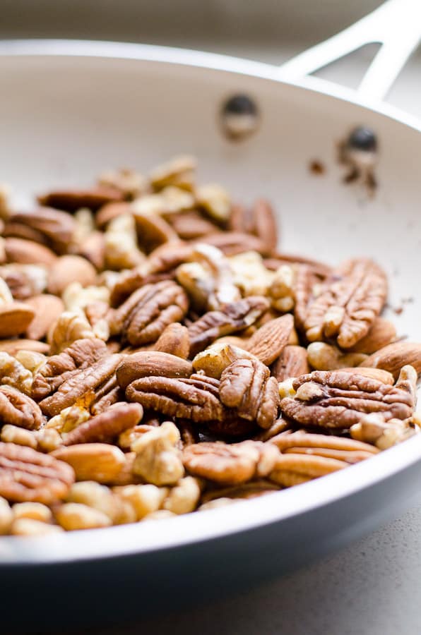 Toasted nuts in a skillet.