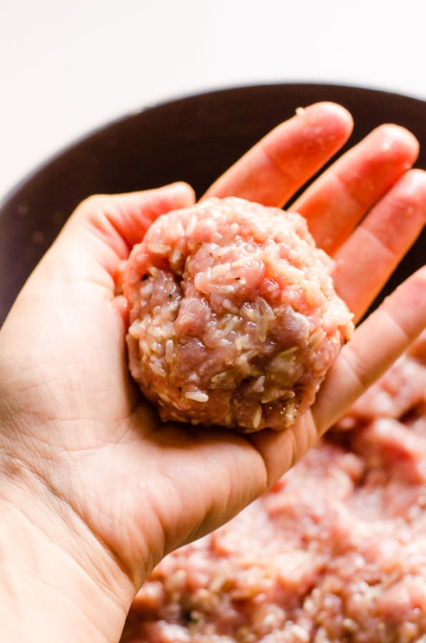formed meatball in a hand