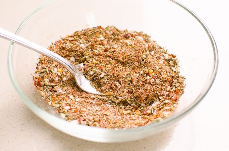 spices for cajun chicken in a bowl with a spoon