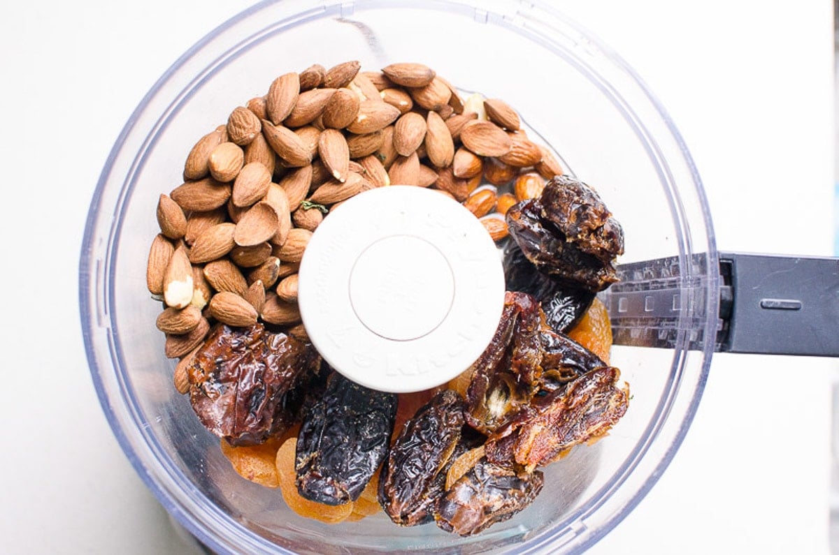 Almonds, dates and dried apricots in a food processor.