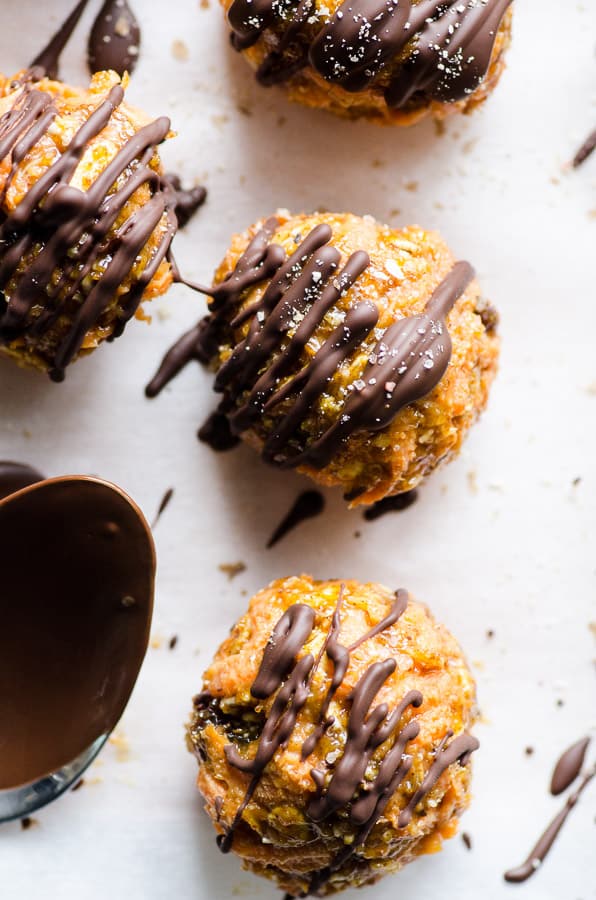 Close up of carrot cake truffles with chocolate drizzle.