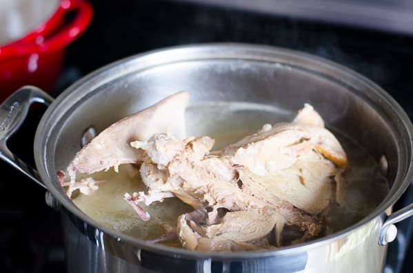 Soup bones cooked in broth in a large stock pot.