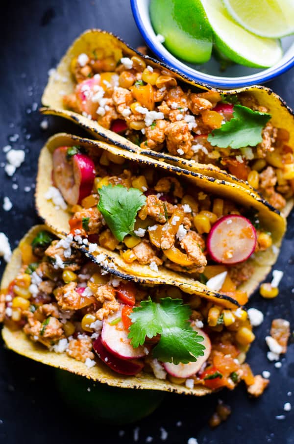 3 ground chicken tacos garnished with cilantro