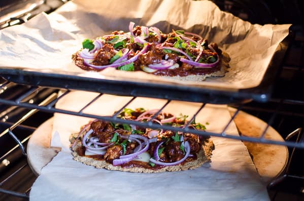 Oatmeal Pizza Crust with bbq chicken and other toppings in the oven.