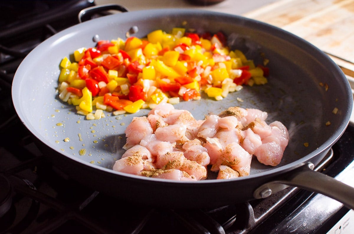 sauteed bell pepper and chicken in a skillet