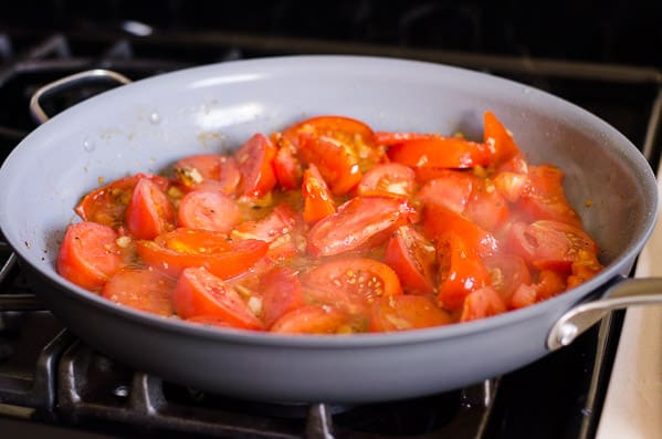 cooking tomatoes in a skillet