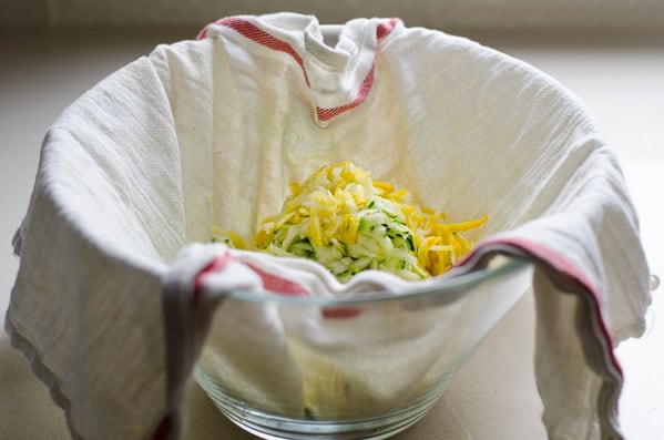 zucchini in a towel placed in a bowl