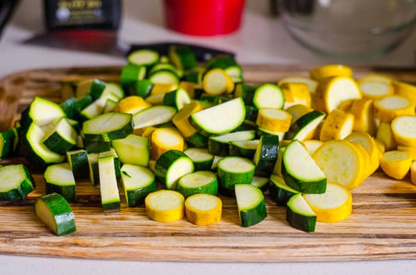 Chopped zucchini on a cutting board.