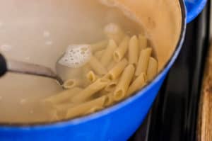 cooked pasta in a pot with water