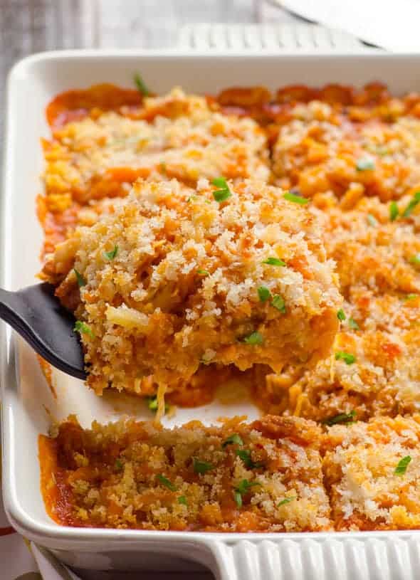 Spaghetti squash casserole being served with spatula.