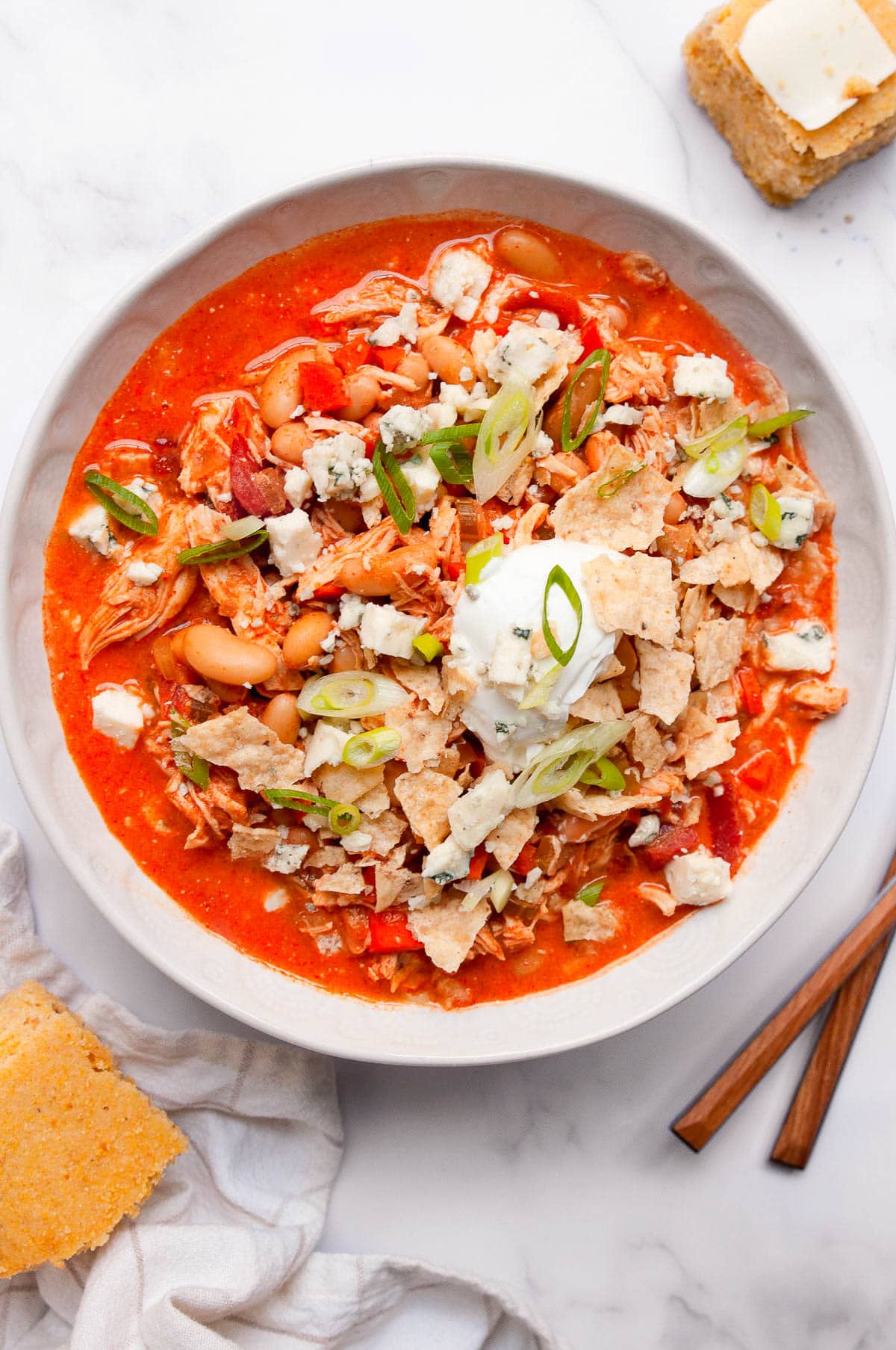 Buffalo Chicken Chili in bowl with cilantro lime and blue cheese