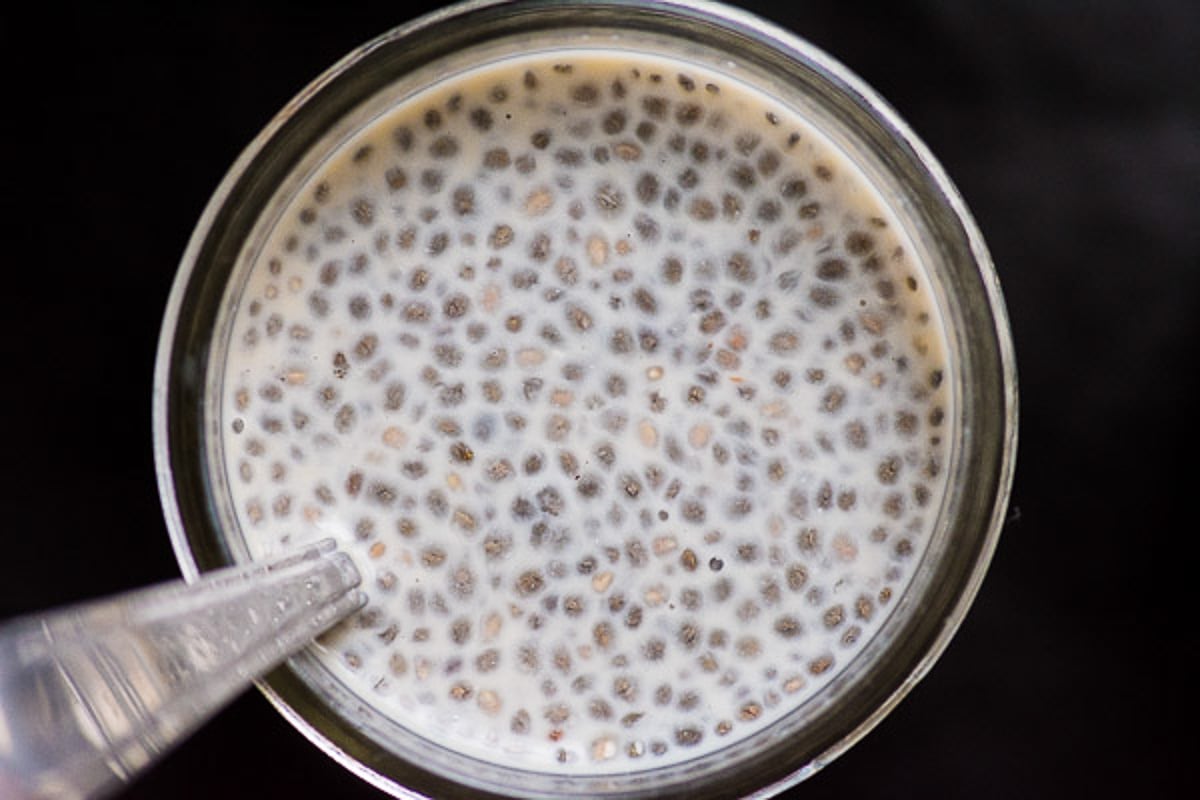 A spoon in a jar of overnight chia pudding. 