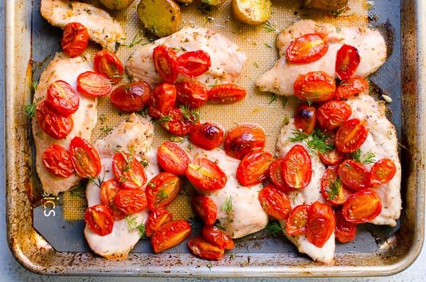 One pan chicken and potatoes on silpat lined baking sheet.