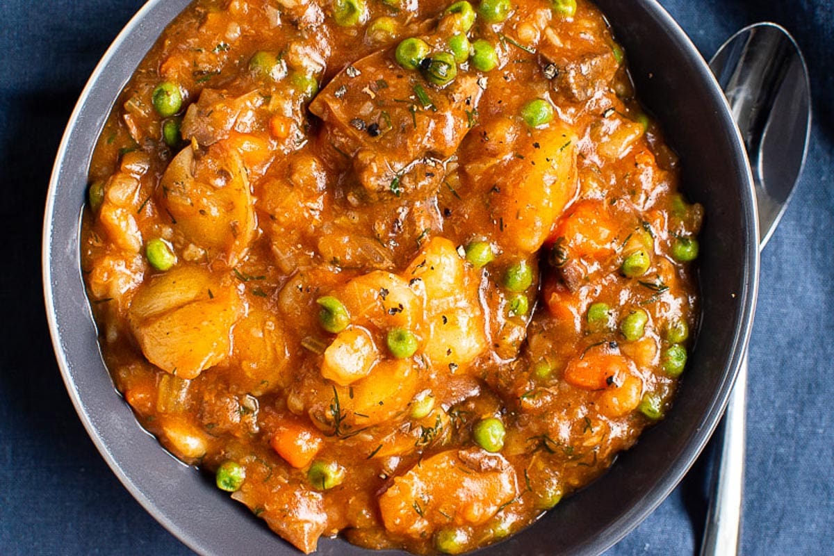 Instant Pot Beef Stew served in a bowl with a spoon.