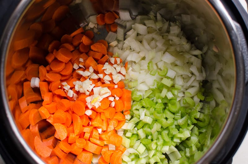 Celery, carrots, and onion in Instant Pot.