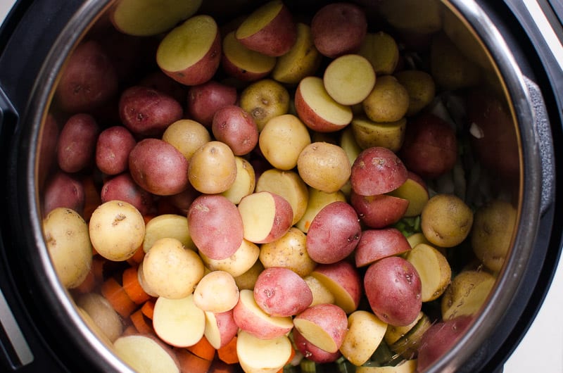 Small potatoes cut in half in Instant Pot.