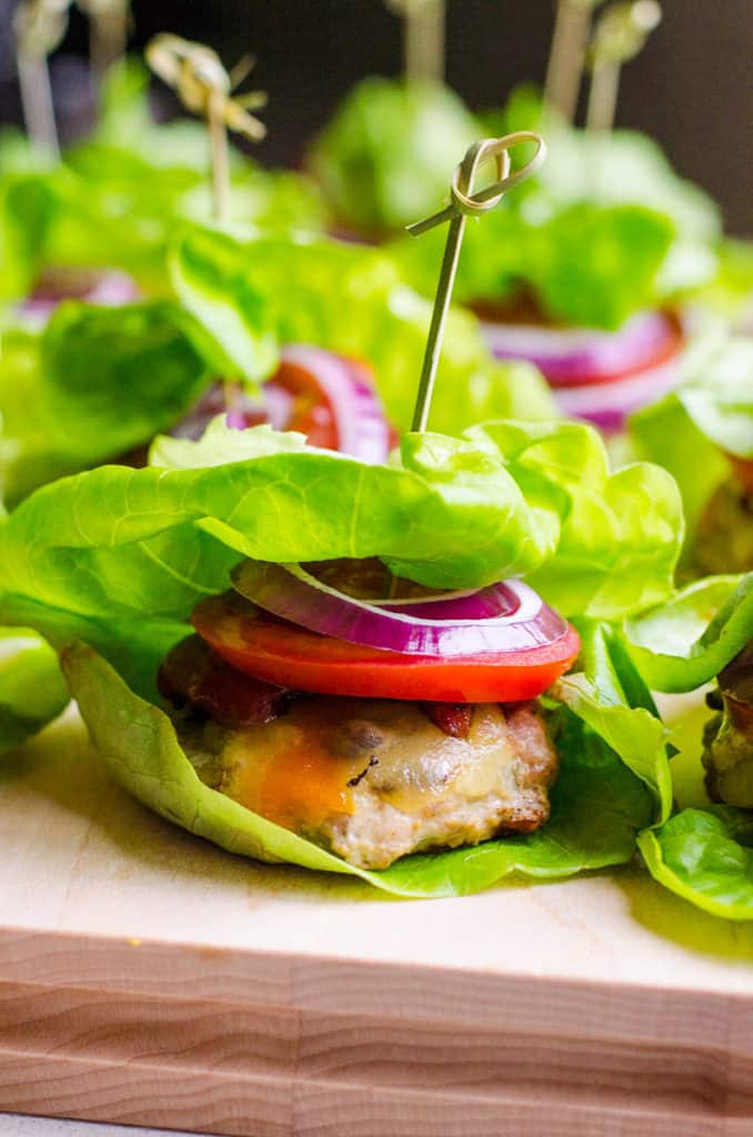 Turkey sliders wrapped in lettuce leaf with a toothpick.