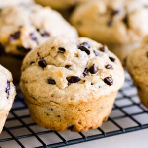 Healthy chocolate chip muffins on a cooling rack.