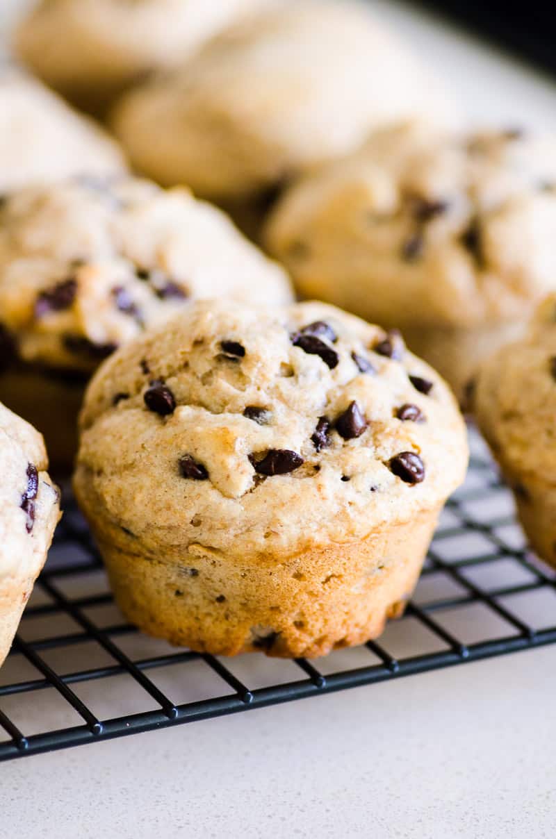 Healthy chocolate chip muffins on a wire rack.