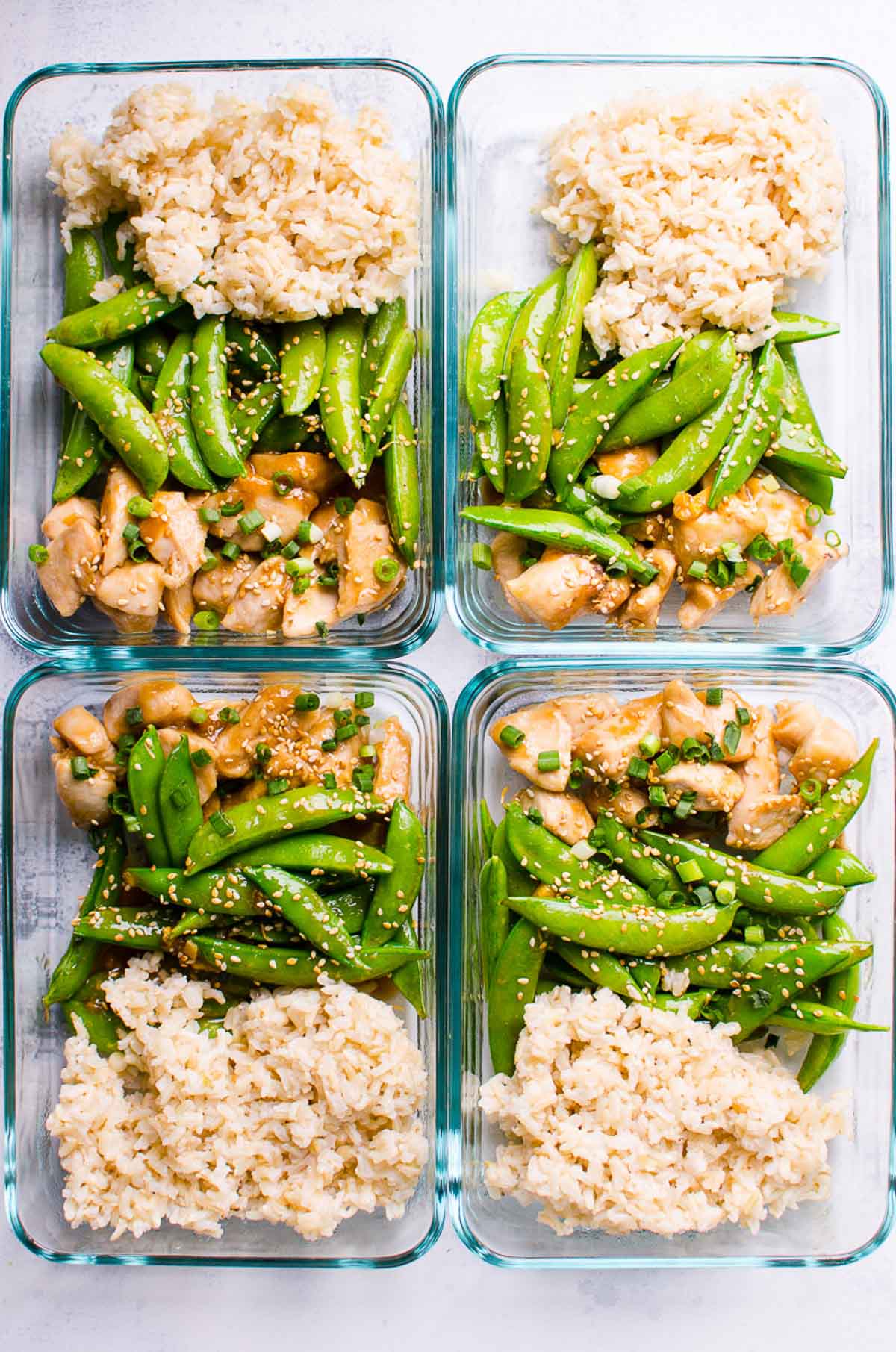 Healthy Teriyaki Chicken Meal Prep with chicken, snap peas and brown rice in 4 glass containers. 