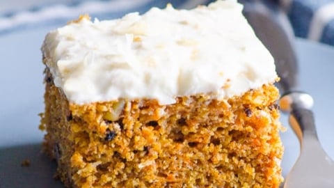 Healthy carrot cake on blue plate with a fork.