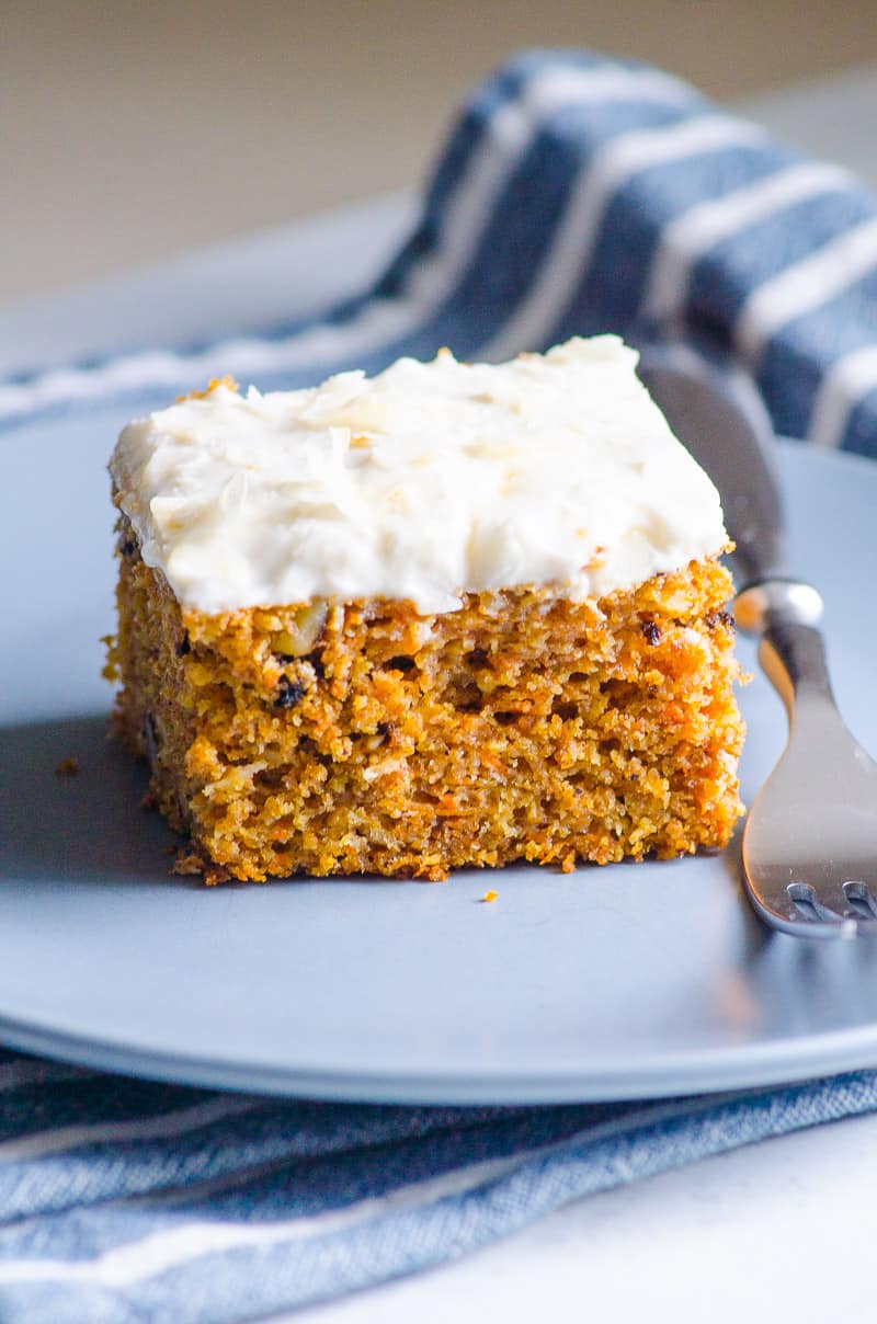 Healthy carrot cake on blue plate with a fork.