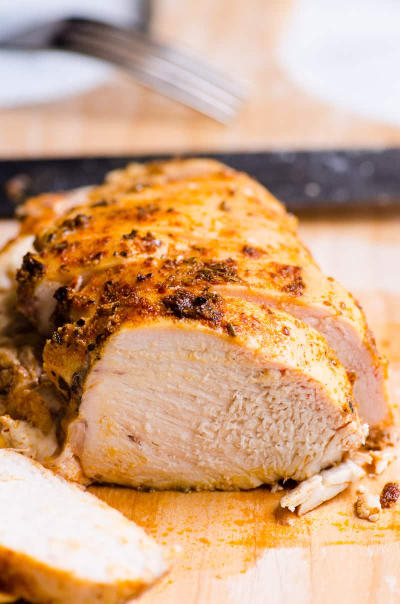 sliced oven oven roasted chicken juicy breast recipe on the cutting board