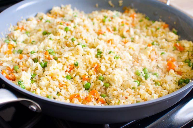 Healthy cauliflower fried rice in skillet.