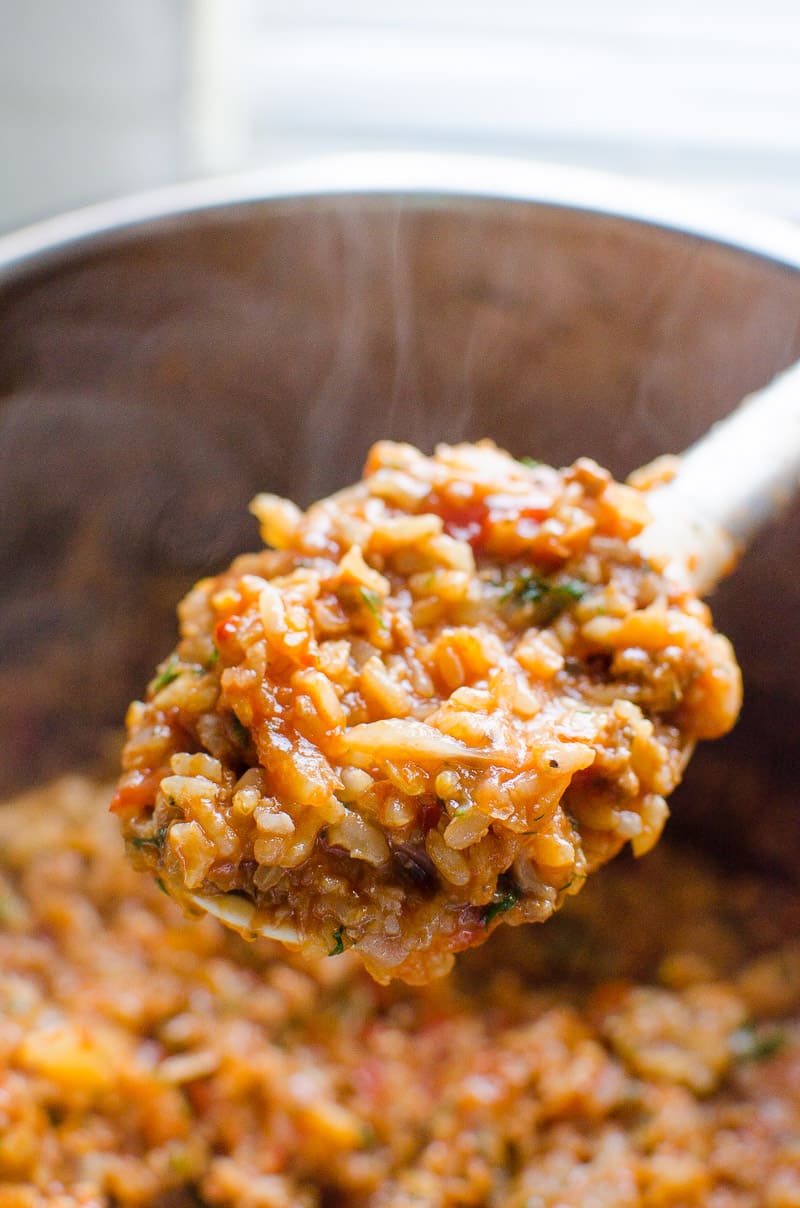 Instant Pot Cabbage Rolls on a spoon with a steam