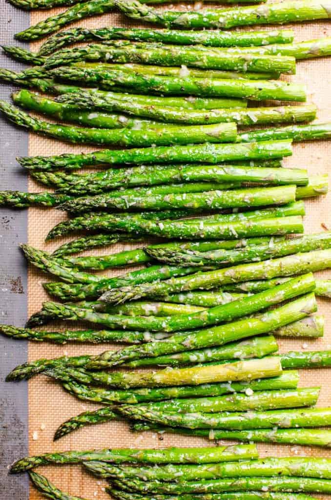 Roasted asparagus on silpat lined baking pan.