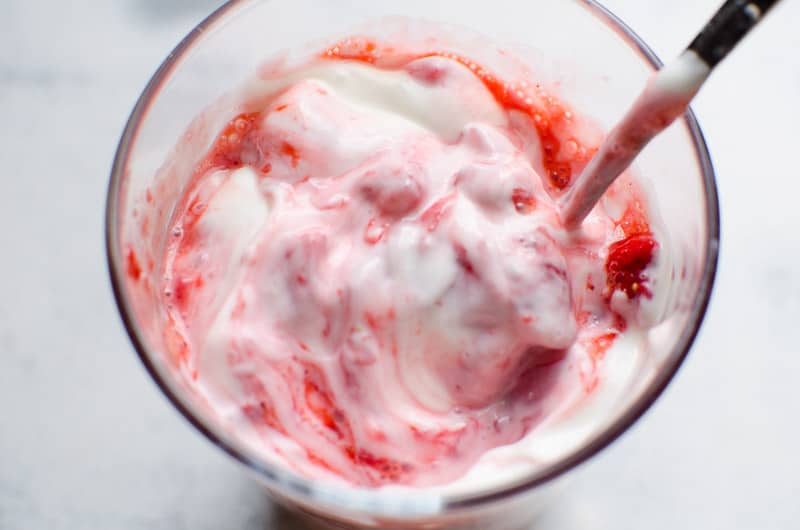 strawberry yogurt in dish with spoon