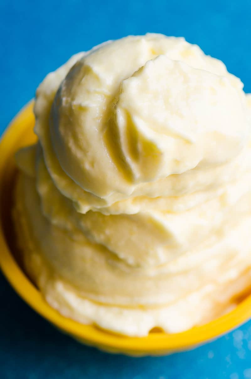 Closeup of pineapple soft serve in yellow bowl