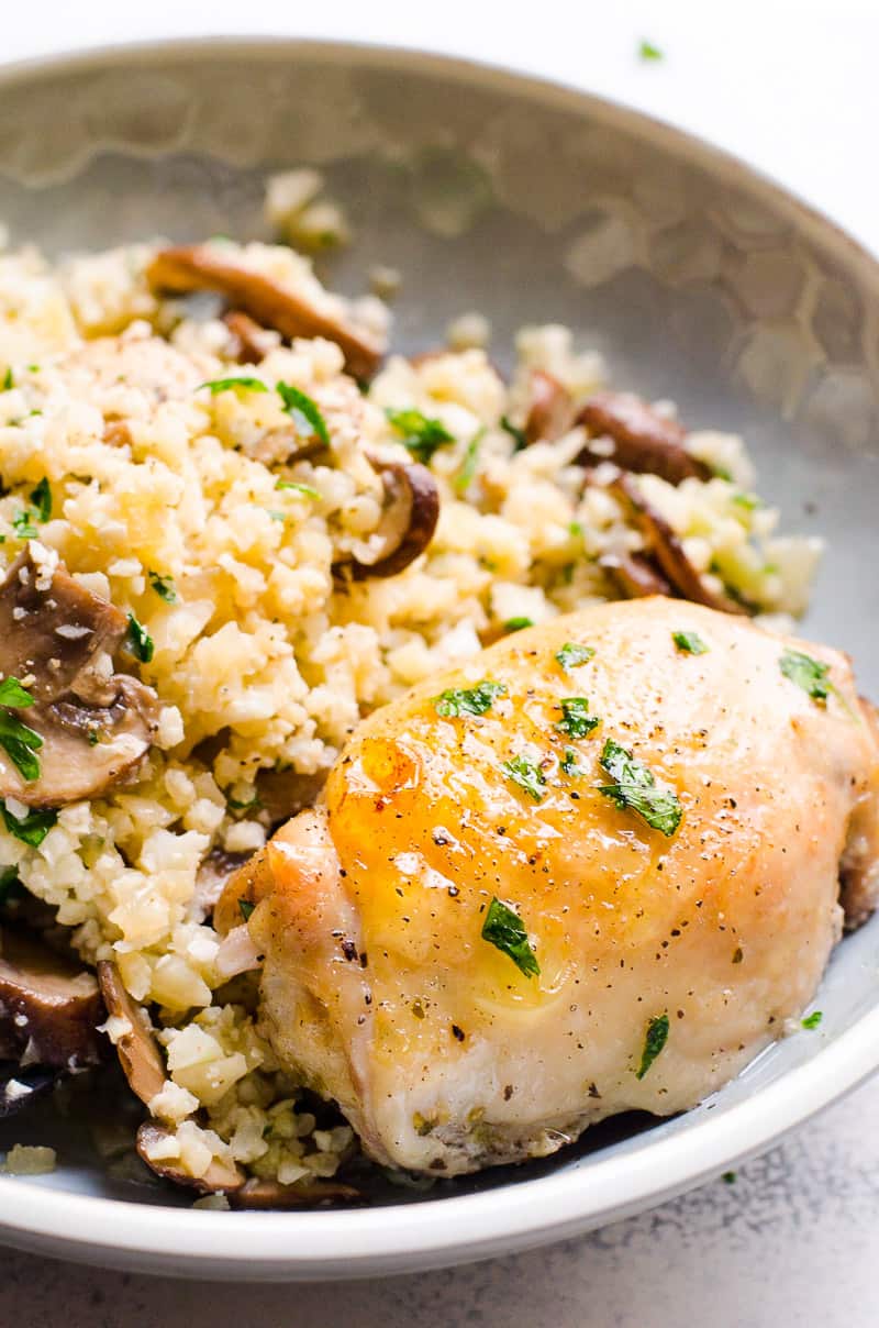 Healthy Chicken Thighs served with cauliflower risotto and garnished with parsley