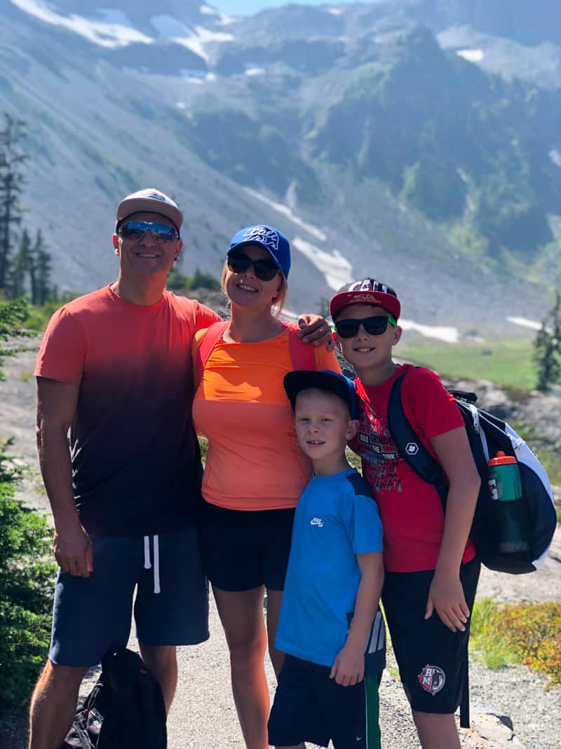 Olena osipov and her family in the mountains.