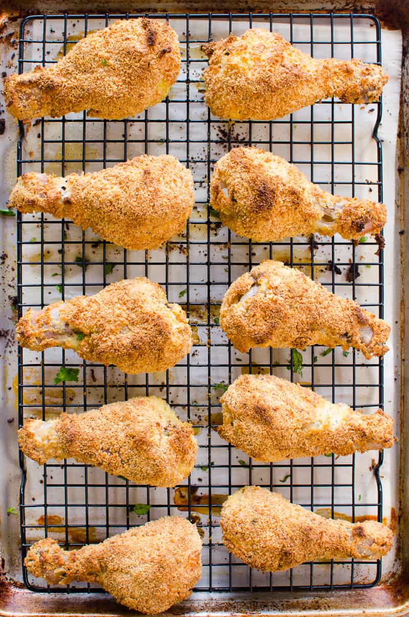 Healthy Oven Fried Chicken on baking tray garnished with parsley