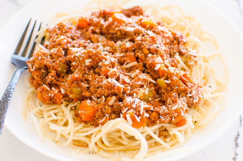 Instant Pot Bolognese over spaghetti on a plate