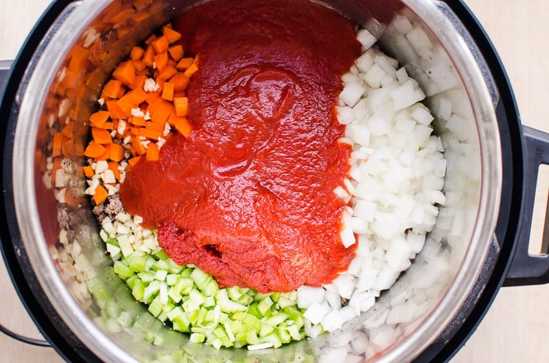 celery, carrots, onion, meat, tomato sauce in instant pot
