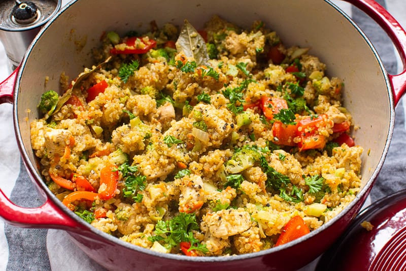 Chicken Quinoa garnished with parsley in red pot